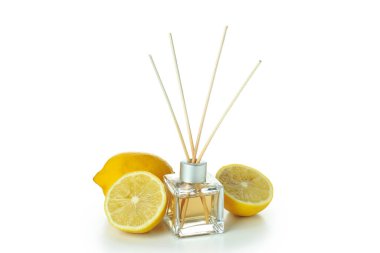 Diffuser bottle with sticks and lemons isolated on white background