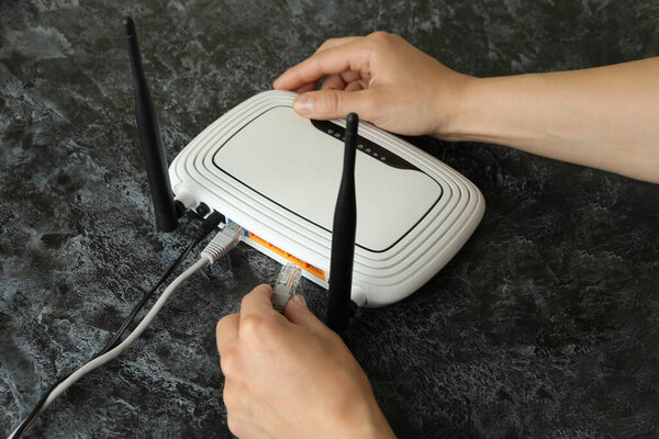 Wi - fi connection concept on black smokey table, close up