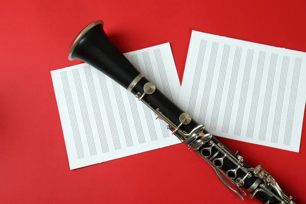 Clarinet Music Sheets Red Background — Stock Photo, Image