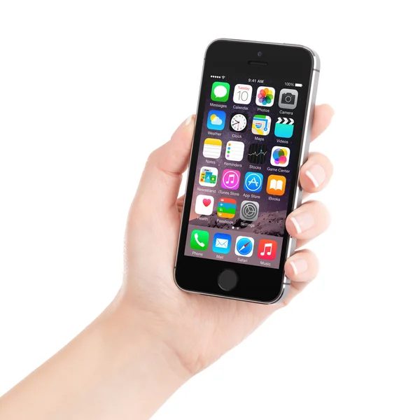 Apple Space Gray iPhone 5S displaying iOS 8 in female hand, desi — Stock Photo, Image