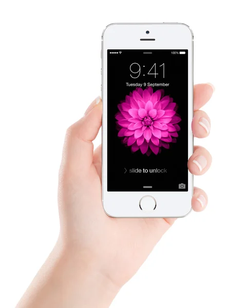 Apple Silver iPhone 5S with lock screen on the display in female — Stock Photo, Image