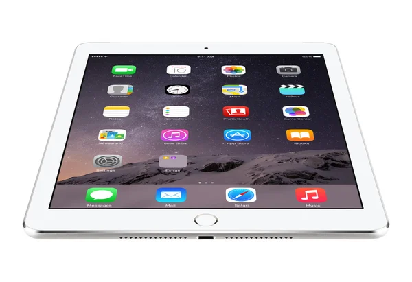 Angled front view of Apple Silver iPad Air 2 with iOS 8 lies on — Stock Photo, Image