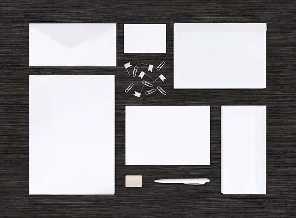Top view of branding identity mockup and template on black table