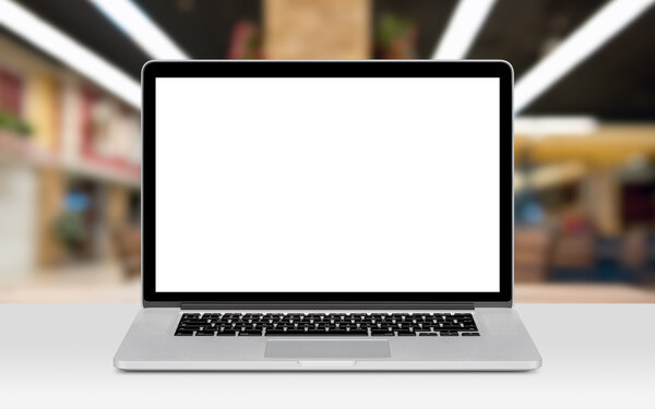 Laptop mockup with white blank display on the desk in office spa
