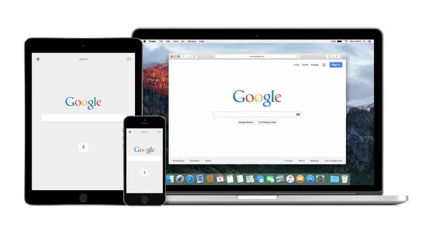 Application Google sur les écrans Apple iPhone iPad et Macbook Pro Images De Stock Libres De Droits