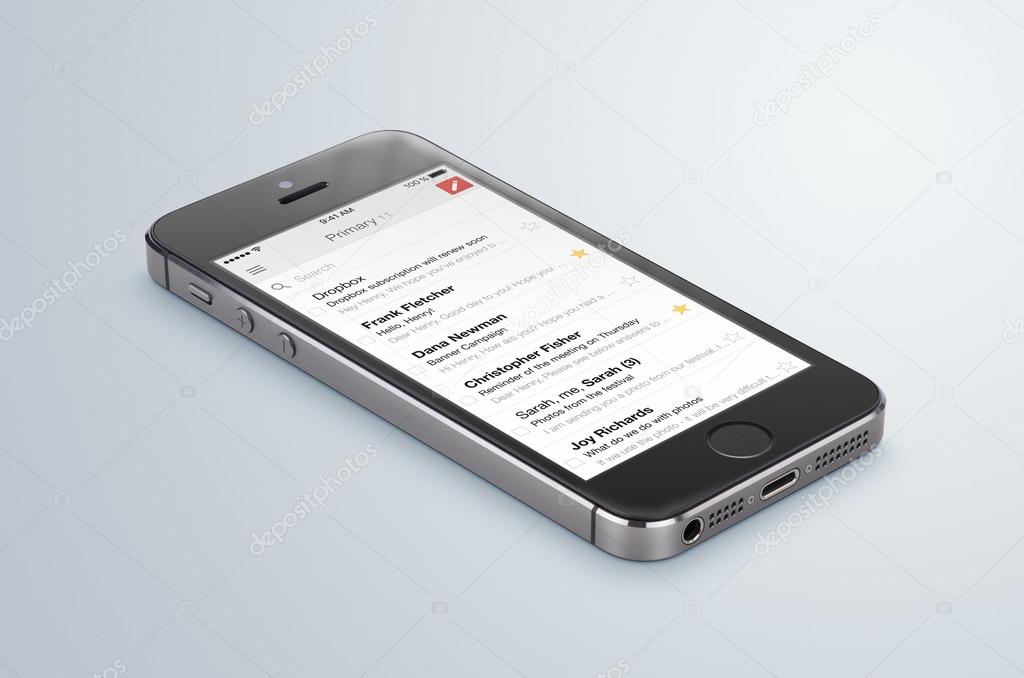Varna, Bulgaria - May 31, 2015: Google Gmail app logo on the black Apple iPhone 5s display that lies on the surface. Gmail is a free e-mail service provided by Google. Isolated on white background.