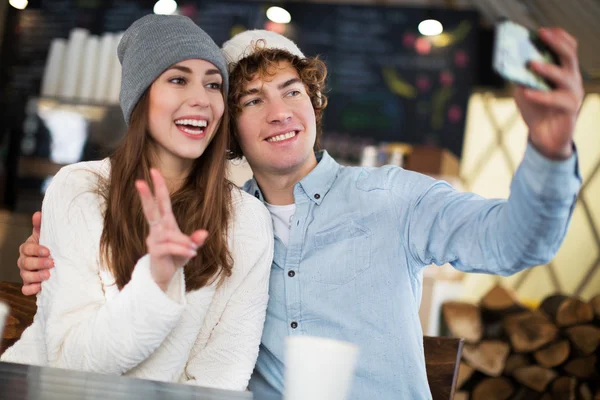 Couple having hot drink on winter day — Stock Photo, Image