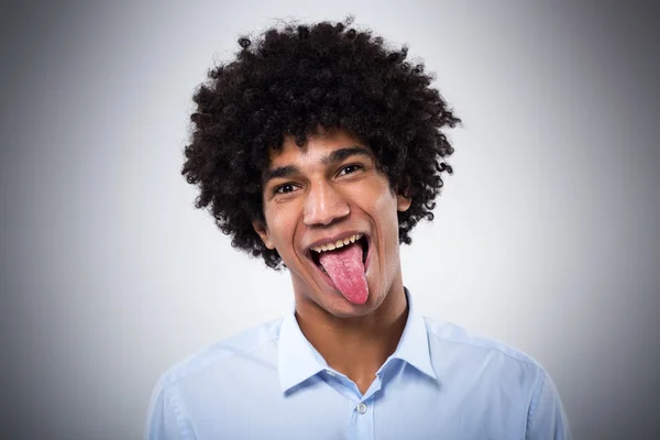 Afro hombre sacando la lengua —  Fotos de Stock