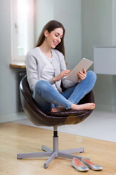 Woman using digital tablet at home — Stock Photo, Image