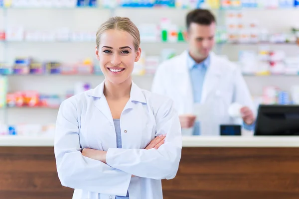 Female and male pharmacists — Stock Photo, Image