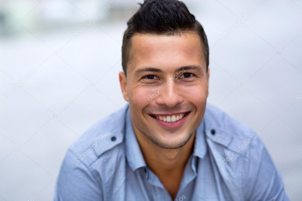 Young man smiling Young man smiling — Stock Photo © pikselstock