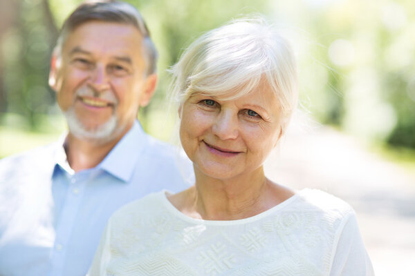 Senior couple standing outdoors
