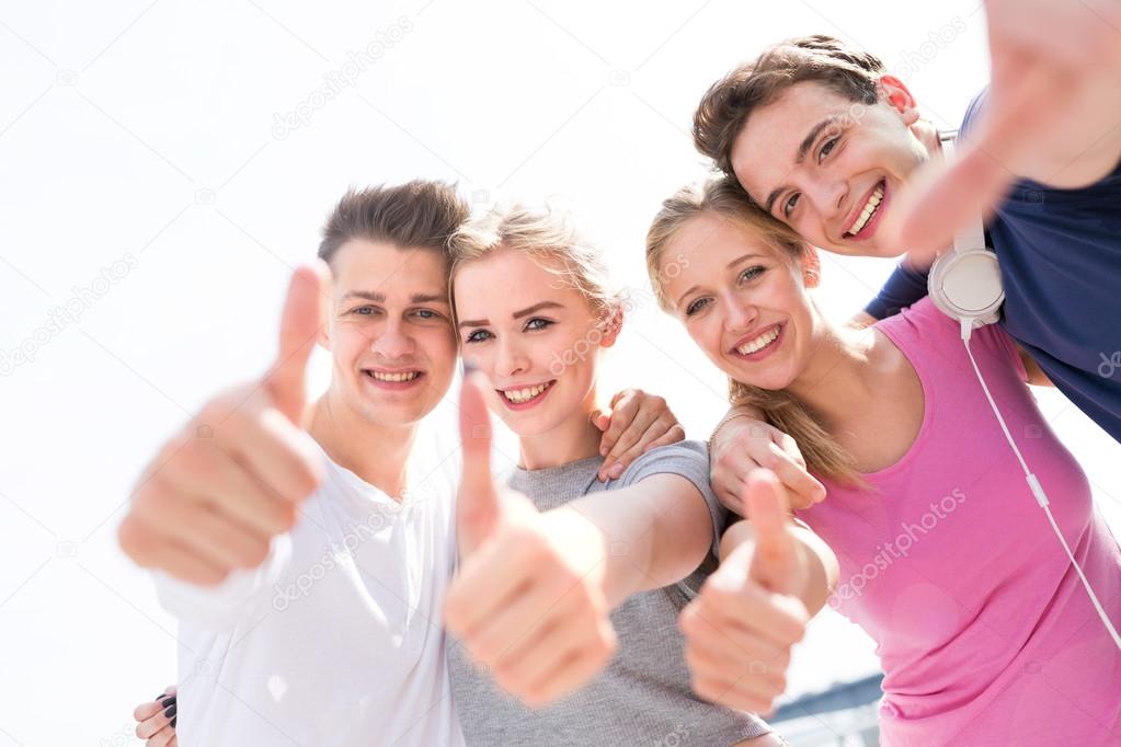 Teens With Thumbs Up