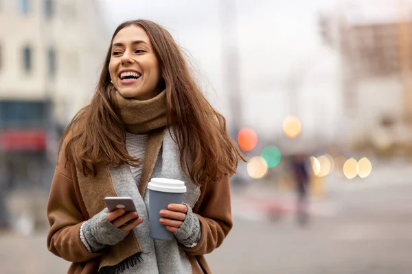 Smiling Young Woman Smart Phone Coffee Cup Outdoors Urban Setting — Stock Photo, Image