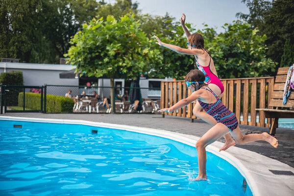 Children playing in the outdoor pool 