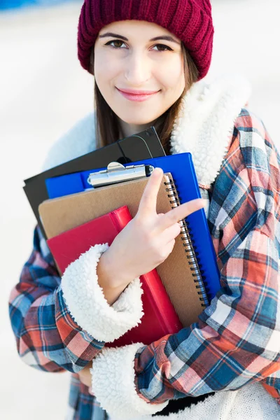 Female student holding books — Stock Photo, Image