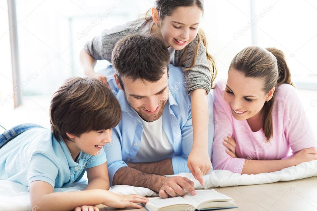 family reading book together