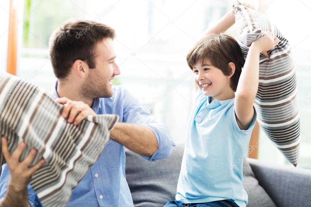 Family lying on sofa