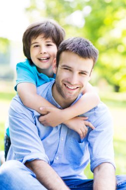 father and little son hugging
