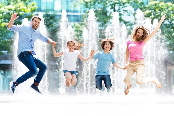 Group of five happy children jumping outdoors., Group of fi…