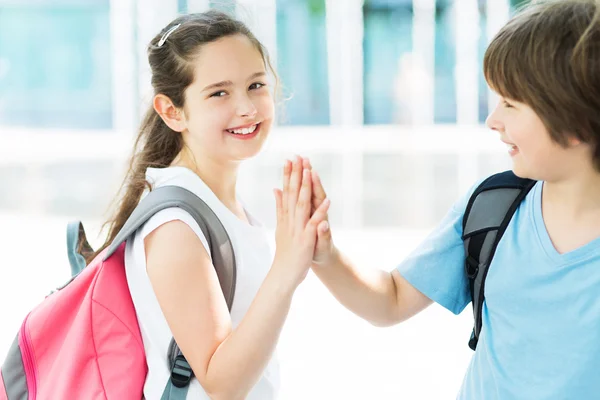 Boy and girl with backpacks — Stock Photo, Image