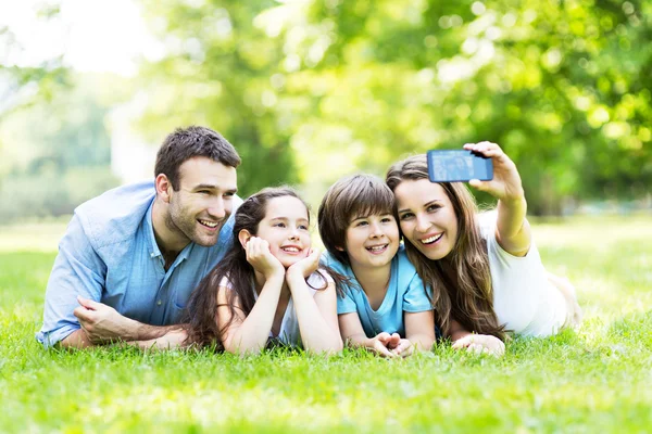 Happy young family making selfie