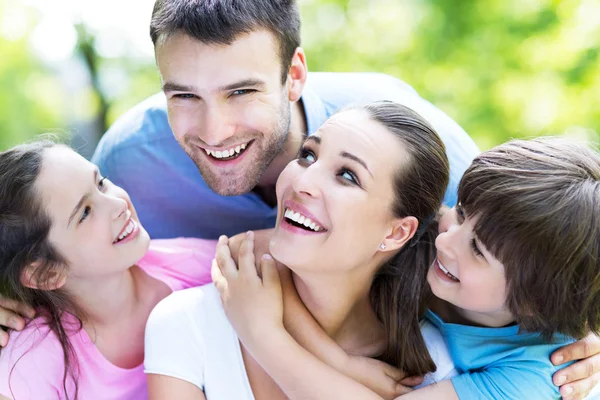 Happy young family hugging — Stock Photo, Image