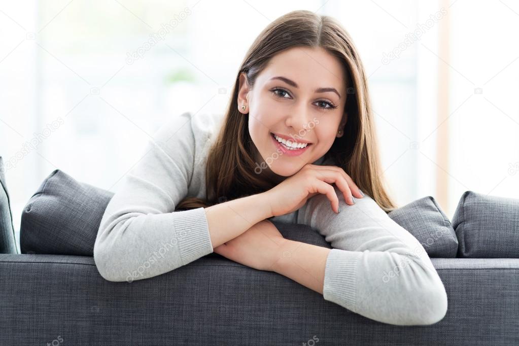 Woman relaxing on sofa