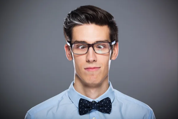 Young man makes funny faces — Stock Photo, Image