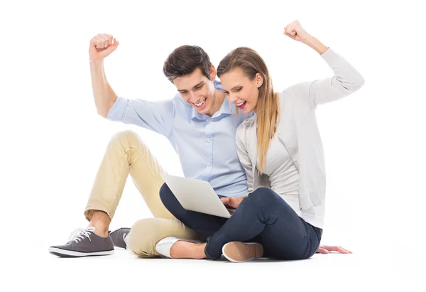 Young couple using laptop — Stock Photo, Image