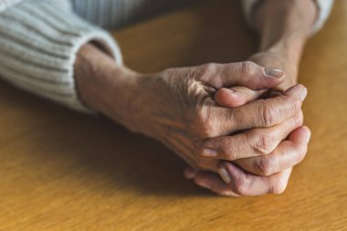 Close-up of an elderly woman's hands at home