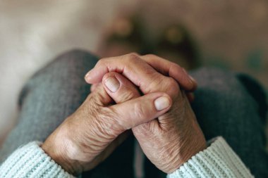 Close-up of an elderly woman's hands at home
