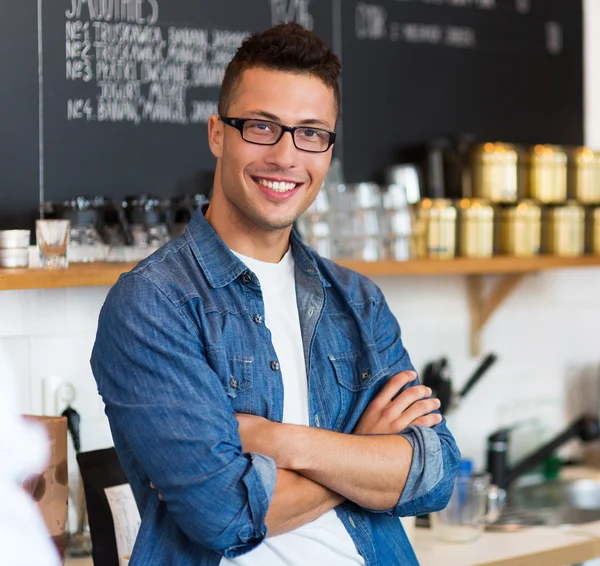 Man working in coffee shop Royalty Free Stock Images