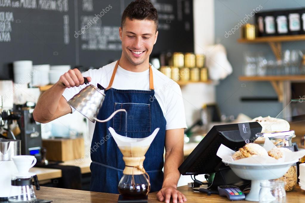 Man working in coffee shop Stock Photo by ©pikselstock 85465048
