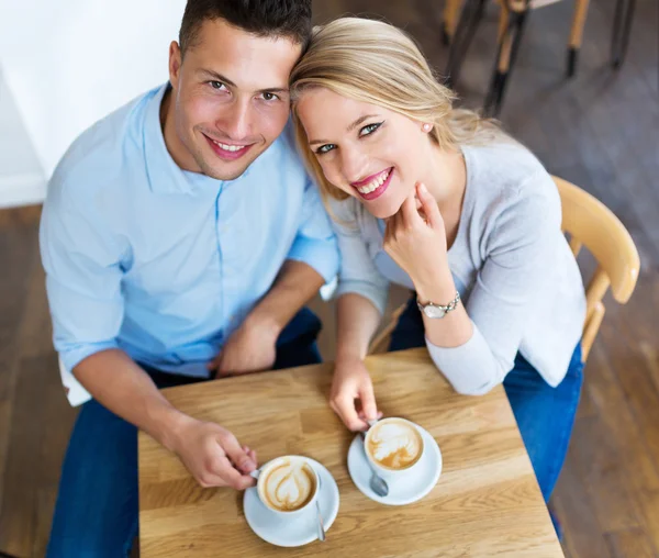 Couple drinking coffee in cafe Stock Picture