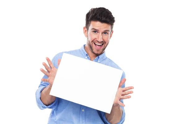 Young man with blank poster — Stock Photo, Image