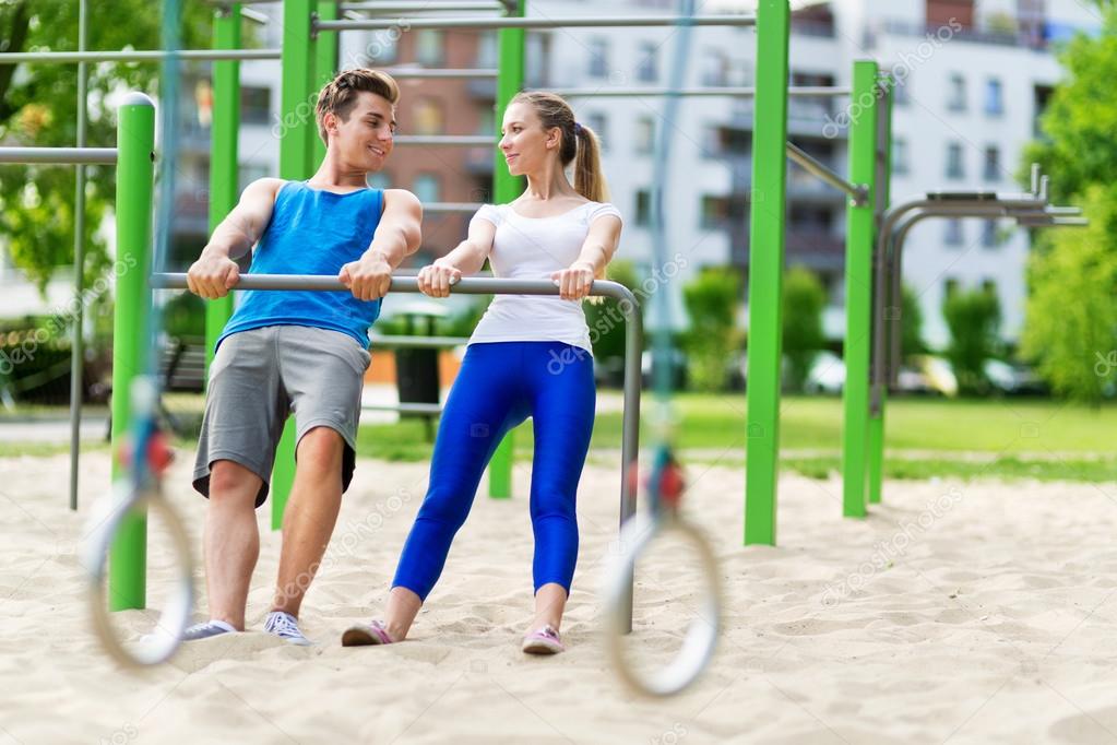 Young couple training outdoors