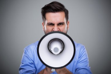 Man shouting through megaphone clipart