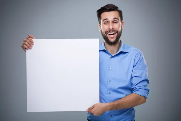 Man hiding behind a copy space — Stock Photo, Image