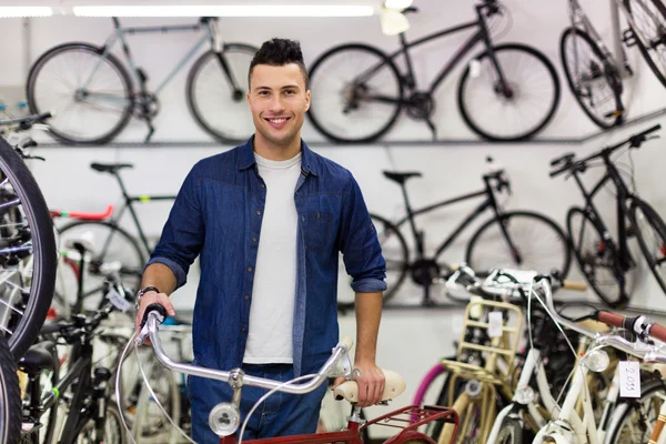 Salesman in bicycle shop — Stock Photo, Image