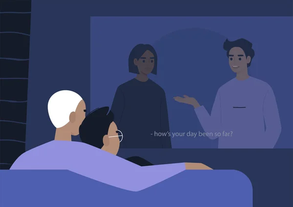 Genç eşcinsel bir çift video projektöründe film izleyip sarılıyor.