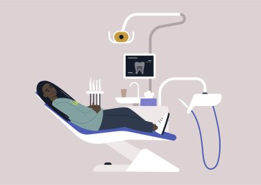 Bir dişçi sandalyesi ve aletler, röntgen görüntülü bir monitör, matkaplar ve stomatoloji dolabındaki diğer aletler.