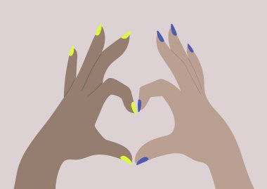 Çeşitlilik kavramı, iki el parmaklarıyla bir kalp işareti oluşturur.