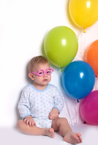 Baby boy with balloons — Stock Photo, Image