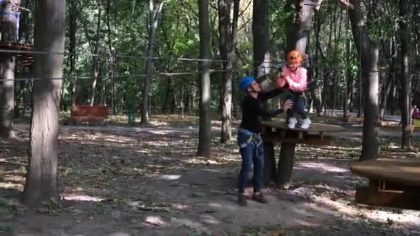 Rope Park Little Girl Overcomes Obstacles Riding Steel Cable Sports — 图库视频影像