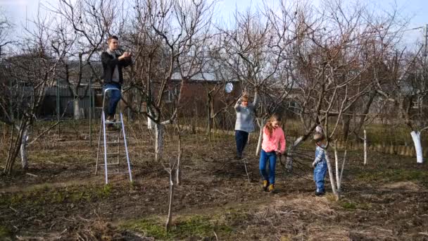 Dad Mom Daughter Son Garden Prune Branches Tree Brush Cutter — Stock Video
