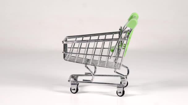 Metal Decorative Small Shopping Cart Green Handles Rotates White Background — Stock Video