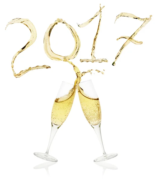 Glasses of champagne toasting to New Year's Eve 2017 — Stock Photo, Image