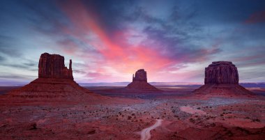 Monument Valley under a scenic sunset sky. Famous Navajo Tribal Park, Arizona - Utah, USA,	