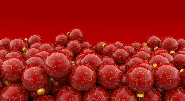 Heap of christmas baubles on red background — Stock Photo, Image